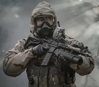 Soldier wearing a CBRN respirator and protective suit