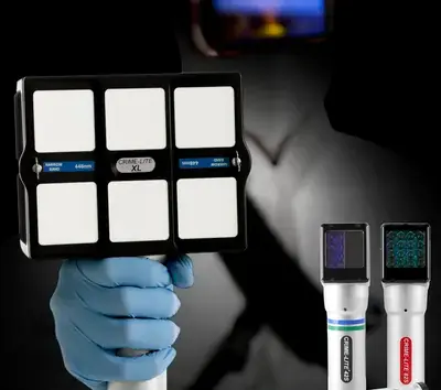Forensic examiner using a Crime-lite light source