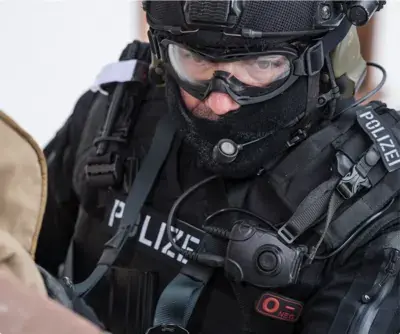 Police tactical officer with helmet and goggles